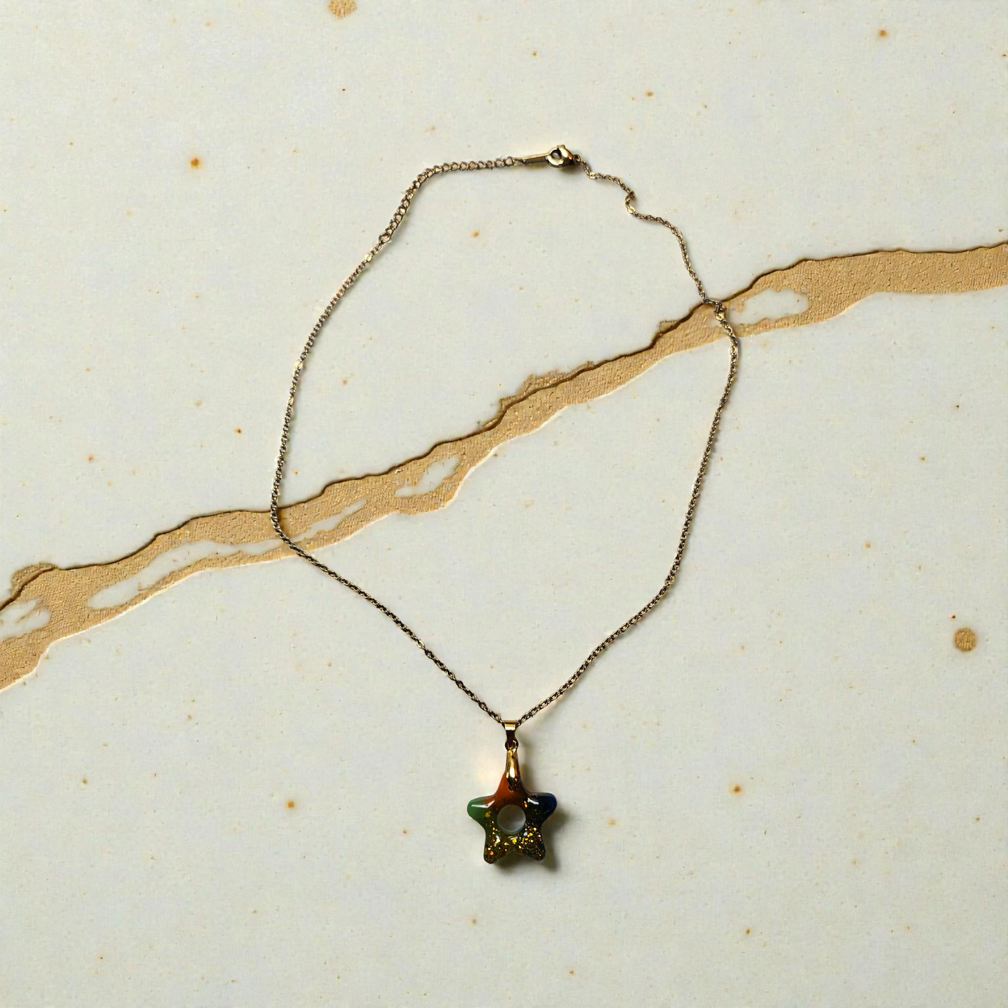 Pendentif étoile multicolores à paillettes doré